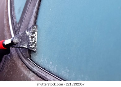 Cleaning Snow From Windshield, Scraping Ice, Winter Car Window Cleaning