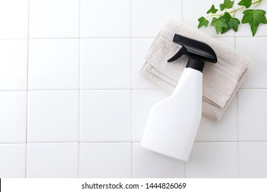 Cleaning Spray Bottle On White Tile