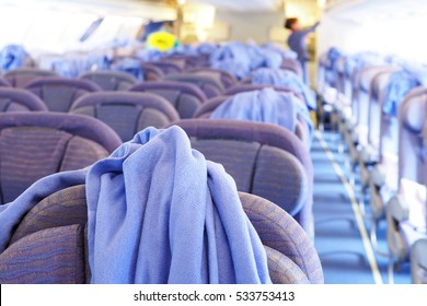 Cleaning Staffs Clean The Airplane Cabin Including Blankets, Pillows And Passenger Seats. Selective Focus.