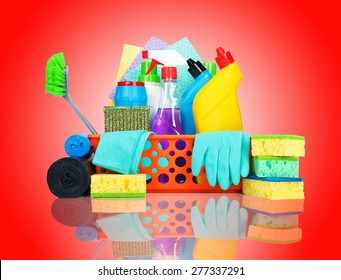 Cleaning supplies in a basket - cleaning and housekeeping concept - Powered by Shutterstock