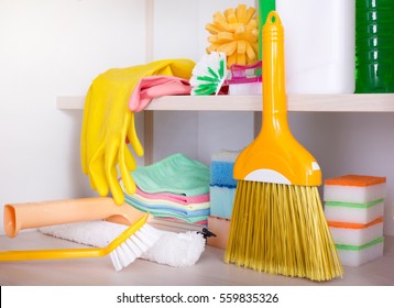 Cleaning Supplies And Tools Arranged On Shelves In Storage Place