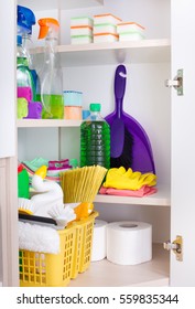 Cleaning Supplies And Tools Arranged On Shelves In Storage Place