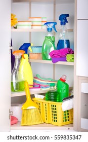 Cleaning Supplies And Tools Arranged On Shelves In Storage Place