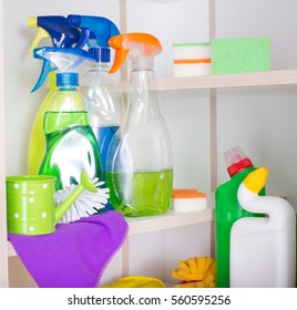 Cleaning Supplies And Tools Arranged On Shelves In Storage Place