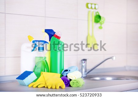 Cleaning supplies and tools on the kitchen countertop