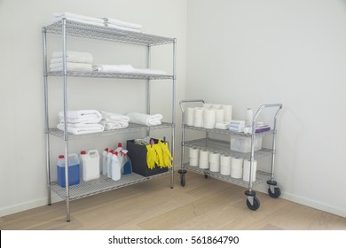 Cleaning supplies and tools (towels) arranged on shelves made of steel at home. - Powered by Shutterstock