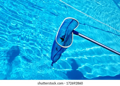 Cleaning swimming pool blue skimmer before closing