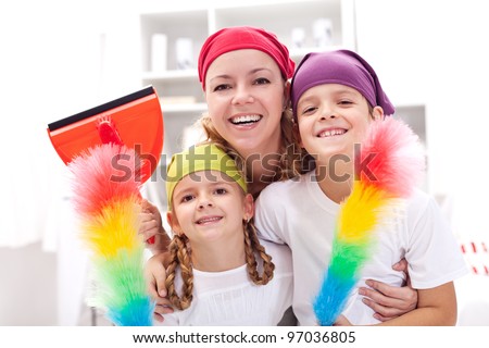 Cleaning task-force - woman with kids holding utensils