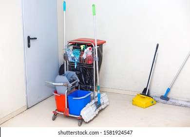 Cleaning Tools Cart Wait For Cleaning.Bucket And Set Of Cleaning Equipment In The Office And Department Store. Cleaning Service Concept