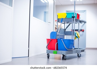 Cleaning Trolley With Yellow Caution Sign