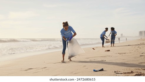 Cleaning, volunteer and team of women, beach and gloves for recycling, waste and outdoor in nature. Collaboration, group and female people, ready and helping environment, cleaning and litter in sea - Powered by Shutterstock