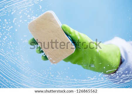 Cleaning - cleaning window pane with  detergent, spring cleaning concept