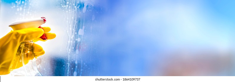Cleaning window with squeegee blue sky