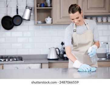 Cleaning, wipe and woman with smile kitchen counter with cloth for hygiene, remove bacteria or chores. Apron, sanitizer and person with spray bottle for housekeeping, detergent or disinfect in home - Powered by Shutterstock