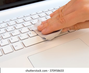 Cleaning Woman With A Gray Rag Of A Computer Keyboard