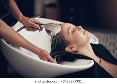 Cleaning, woman or hands of hairdresser with customer in salon or basin for washing treatment. Rinse, scalp and grooming service for client, person or shampoo cosmetics for beauty, wellness or spa - Powered by Shutterstock