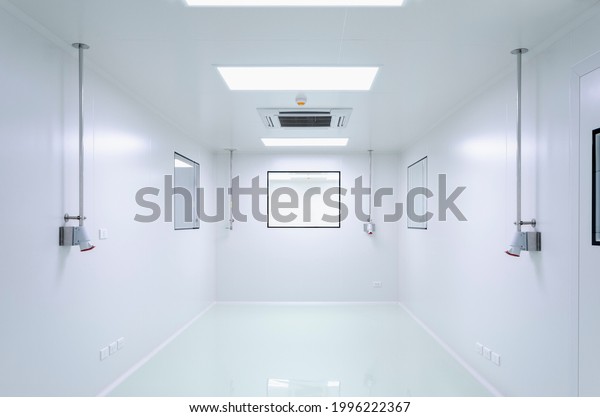 Cleanroom\
in manufacturing pharmaceutical plant, Green epoxy system flooring,\
Sandwich Panel, door, and double glass\
window