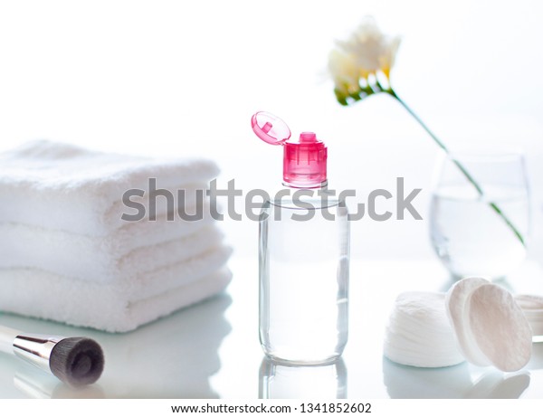 Cleansing face or make up remover cosmetic\
bottle in the bathroom concept close\
up