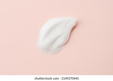 Cleansing foam for face, hands or body. Face cleansing mousse sample texture closeup.. White cleanser foam bubbles on pastel pink background. - Shutterstock ID 2149270445