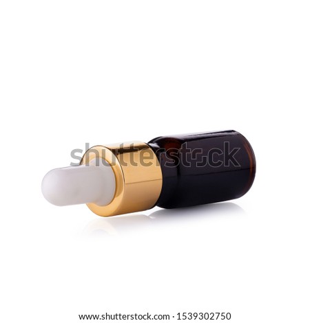 Clear Amber Glass Bottle With Bamboo Dropper isolated on white background.