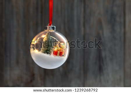 Clear Ball Ornament  with christmas tree,  small gift and christmas light inside.
