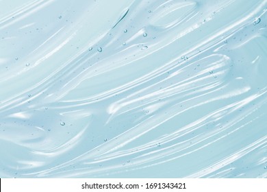 Clear blue gel texture. Hand sanitizer, alcohol gel, moisturizer swatch. Clear transparent  skincare product sample closeup