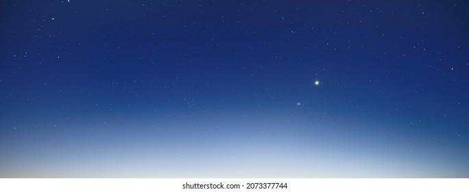 Clear blue glowing sky. Moonrise, twilight, night, stars. Concept art, meteorology, heaven, hope, peace. Graphic resources, picturesque panoramic scenery - Shutterstock ID 2073377744