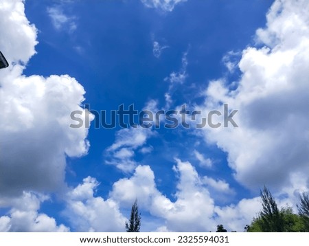 Clear blue sky background. Sunny blue sky with white cloud.