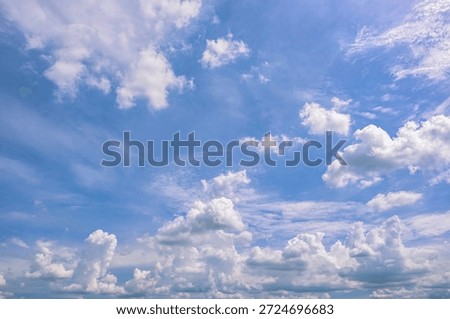 clear blue sky background,clouds with background, Blue sky background with tiny clouds. White fluffy clouds in the blue sky. 
Captivating stock photo featuring the mesmerizing beauty of the sky and clouds.	