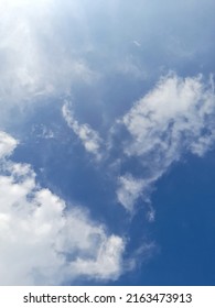 Clear Blue Sky With Drifting Clouds