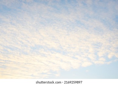 Clear blue sky, glowing pink and golden clouds after storm at sunset. Dramatic cloudscape. Moon, moonrise, midnight sun. Concept art, meteorology, heaven, hope, peace, picturesque panoramic scenery - Shutterstock ID 2169259897
