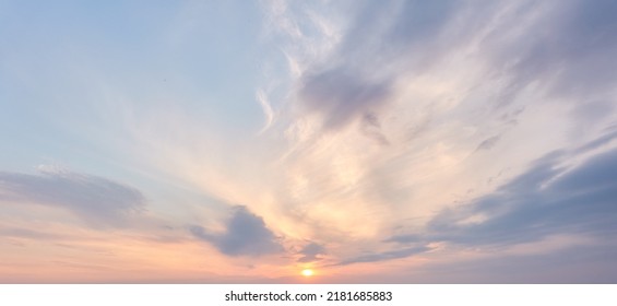 Clear blue sky. glowing pink and golden cirrus and cumulus clouds after storm, soft sunlight. Dramatic sunset cloudscape. Meteorology, heaven, peace, graphic resources, picturesque panoramic scenery - Shutterstock ID 2181685883