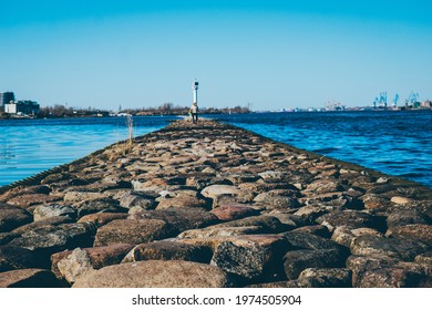 clear blue sky on the pier large stones in the foreground . High quality photo - Powered by Shutterstock