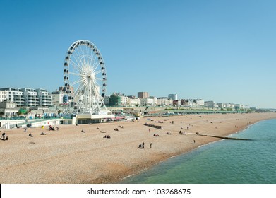 Clear blue sky over Brighton beach, UK and the tourist attractions of Madeira Drive