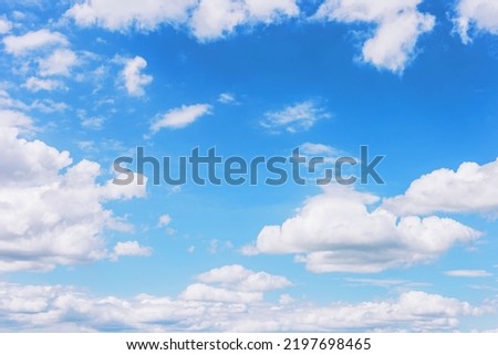 clear blue sky with plain white cloud with space for text background. The vast blue sky and clouds. blue sky background with tiny clouds nature.