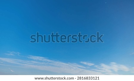 Clear Blue Sky With Thin Wispy Clouds In Daytime
