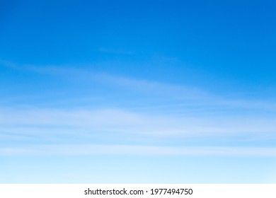 Clear blue sky with white cloud background - Shutterstock ID 1977494750