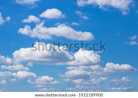 Clear blue sky and white clouds.
Beautiful white cloud on clear blue sky as nature concept . Clear weather for good summer season. Fresh air breeze