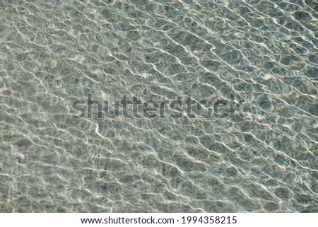 Clear blue water with waves sunlight shadow reflections. Summer vacation background 商業照片 © 