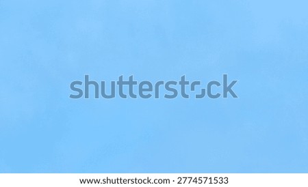 Clear and cloudless solid light blue sky background.