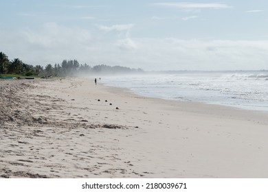 Clear and dense sand against blue sky with clouds and strong sun on Guaibim beach in Valenca city in Bahia, Brazil. - Shutterstock ID 2180039671