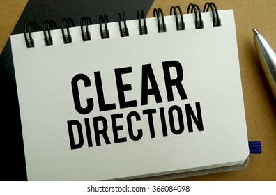 Clear Direction Memo Written On A Notebook With Pen