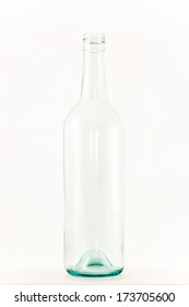 Clear Empty Glass Wine Bottle On White. A Clear Empty Glass Wine Bottle On White