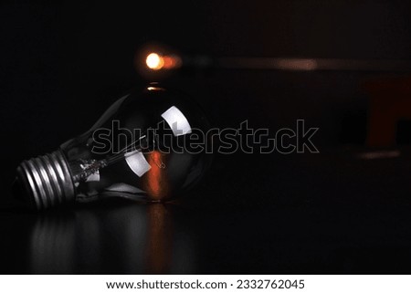 Clear Filament Bulb on Black Pad