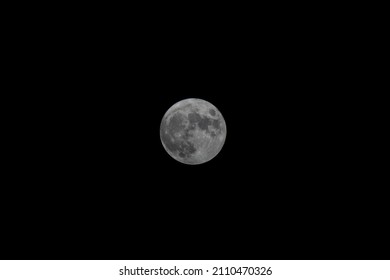 a clear full moon with a black background showing details of crators