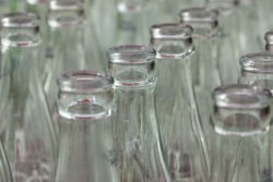 Group of empty glass upside down, a bunch of glass bottle caps sitting ...