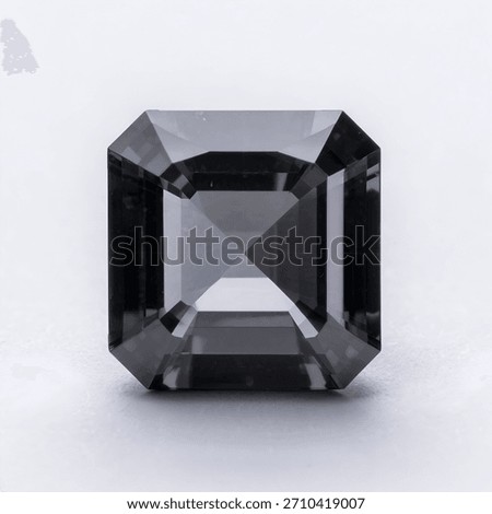 A clear gray emerald-cut gemstone with sharp facets and refined reflections, captured in a clean macro style. Perfect for jewelry design, luxury branding, decorative visuals, digital art, and high-end
