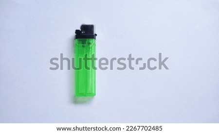 Clear Green plastic gas lighter. Gas lighter isolated on white background with clipping part for design.