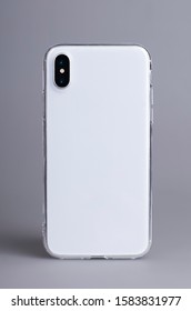 Clear IPhone X Case Mock Up Close Up. Smart Phone In Transparent Case Back View Isolated On Gray Background