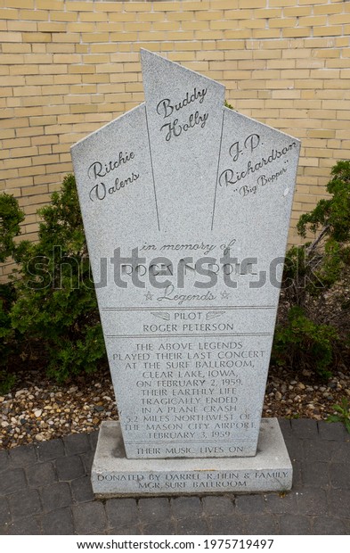 CLEAR LAKE, IA, USA 05-16-21 - A stone\
monument outside the historic Surf Ballroom in Clear Lake, IA pays\
tribute to early rock and roll legends Buddy Holly, Richie Valens\
and J.P. Richardson.